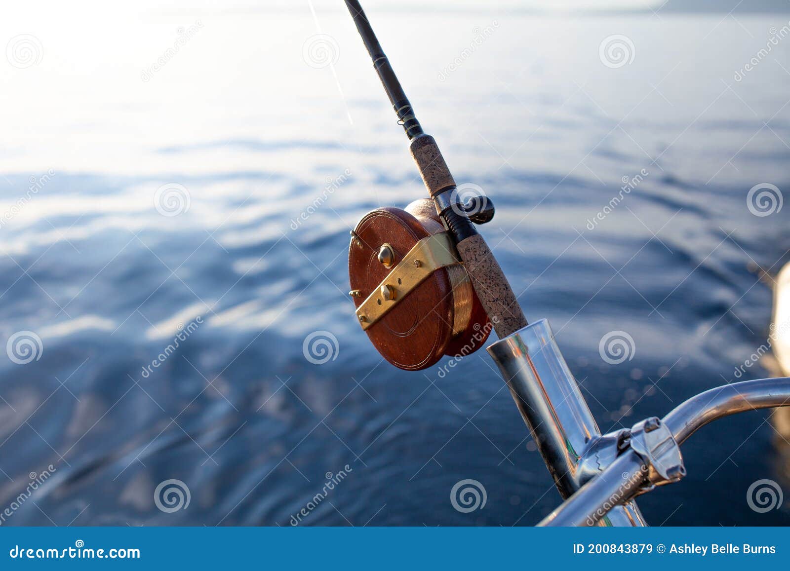 A Close Up of a Wooden Mooching Reel on a Fishing Rod Stock Image