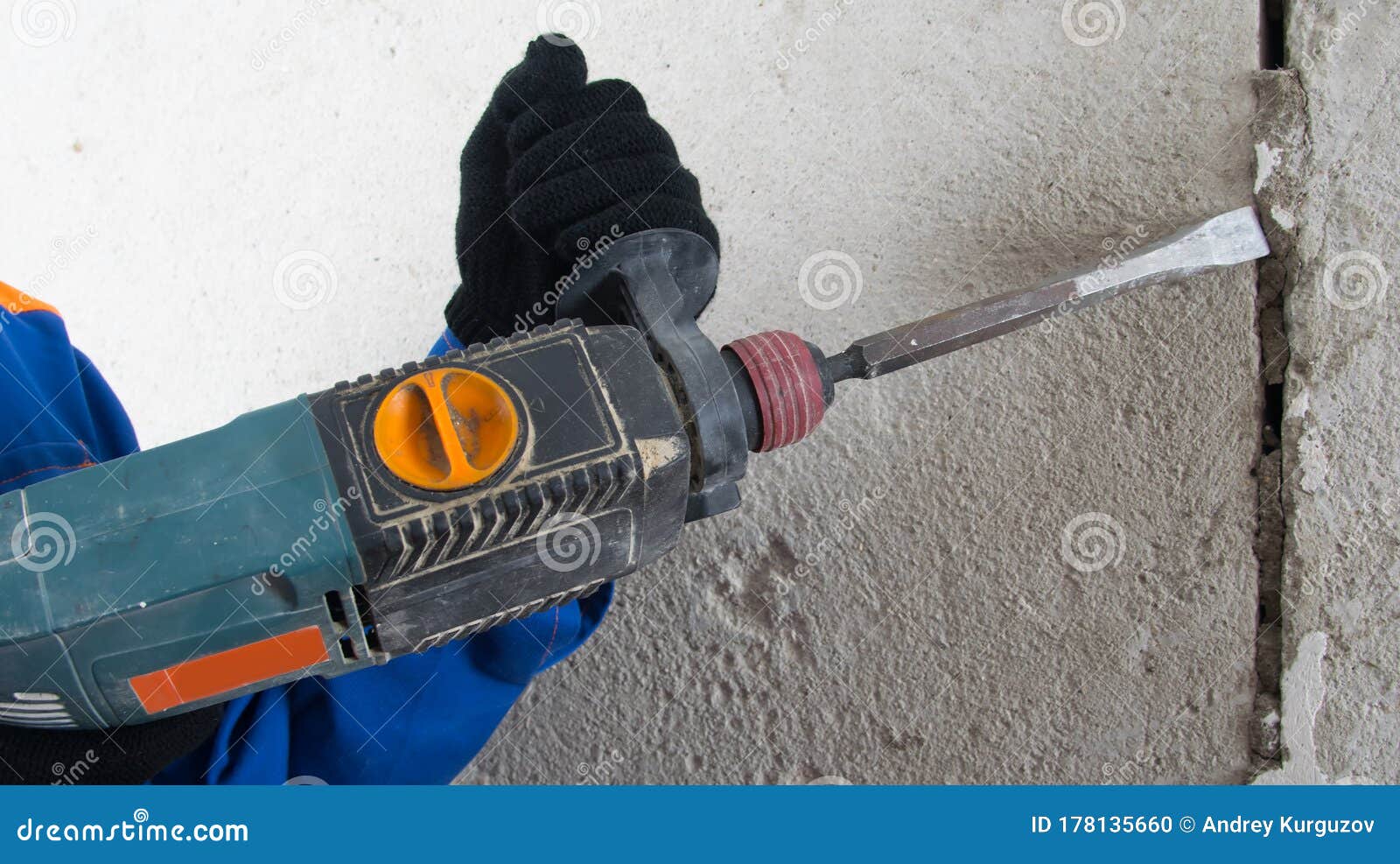 Close Up of a Worker `s Hands, with a Hammer, Clearing the Walls of