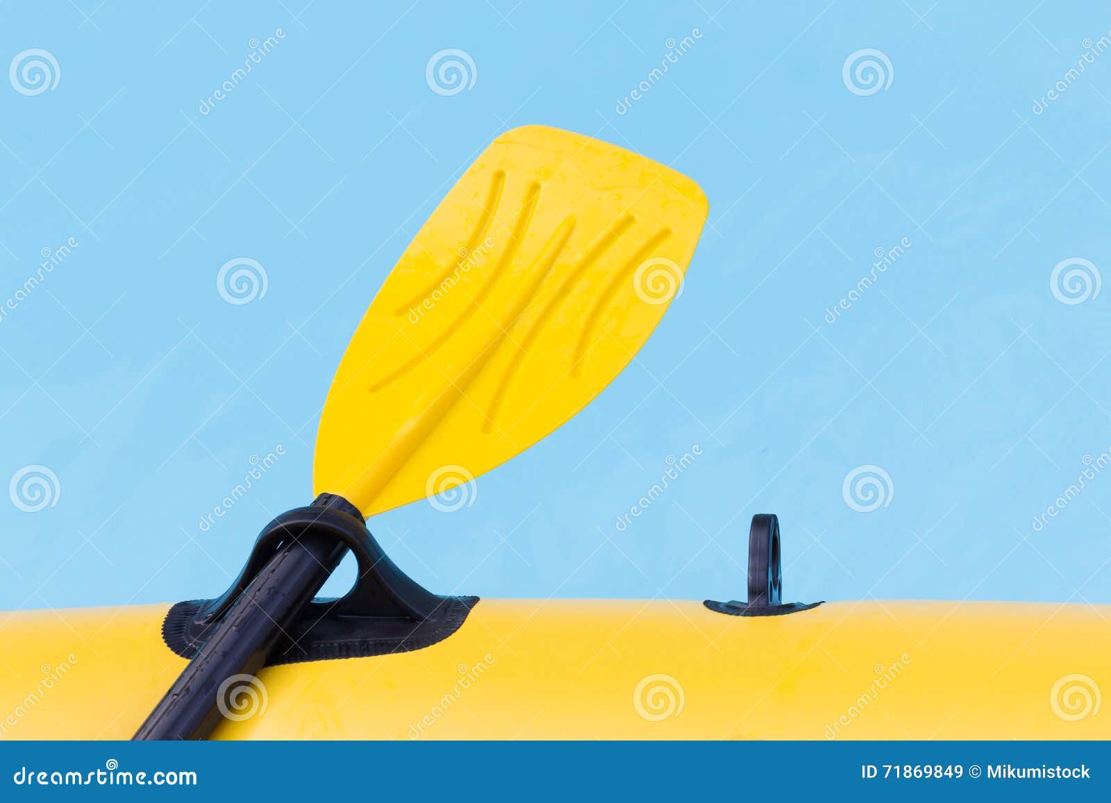 Close up yellow paddle. stock image. Image of copy, blue 71869849