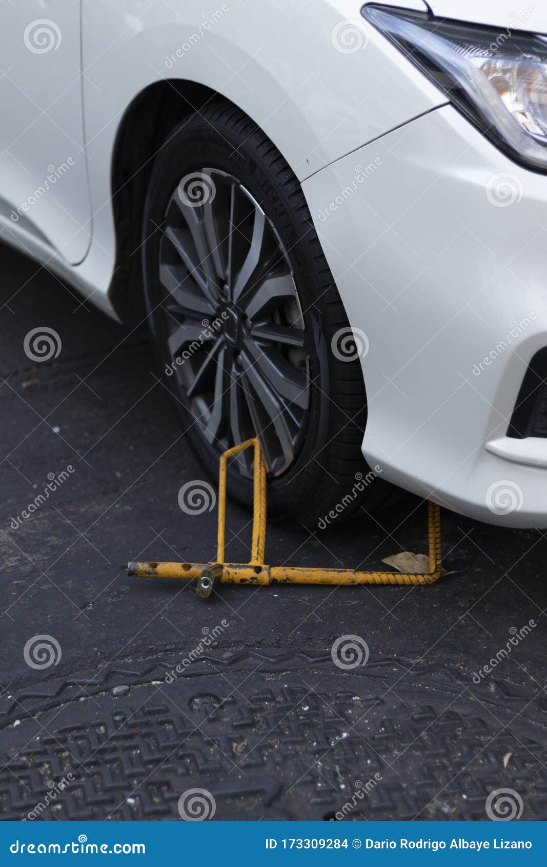 Close Up of Yellow Wheel Locks, White Car Stock Photo Image of park
