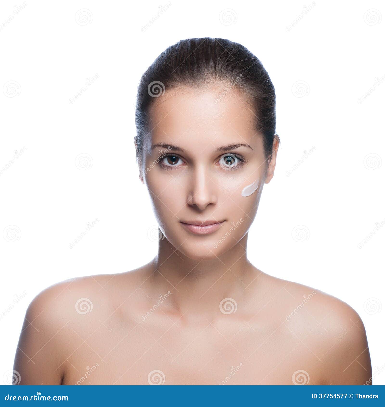 close-up young beautiful face of girl applying moisturize cream