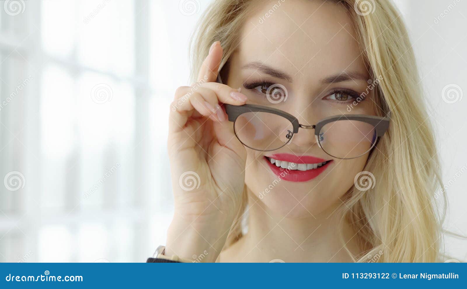 Close Up of a Young Beautiful Woman with Glasses at the Window and ...