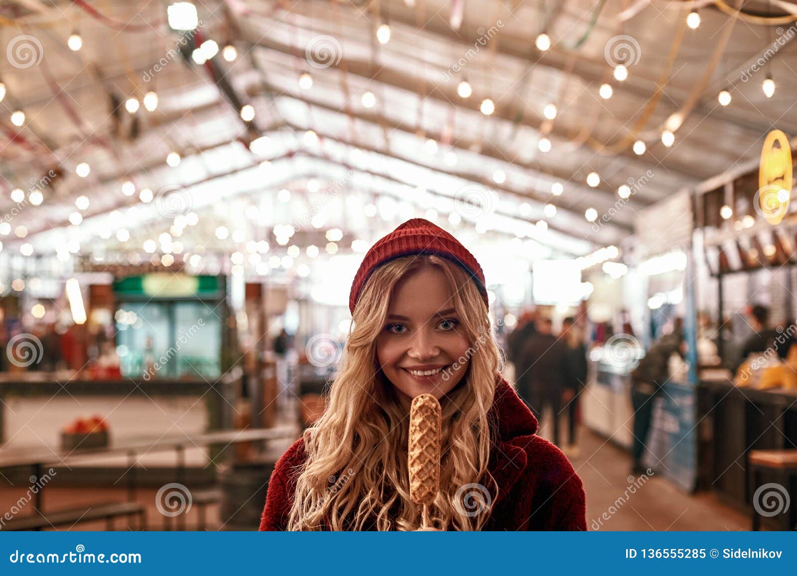 Close-up of Young Blonde Woman Eatting Vegan Sausage in Dough Stock ...