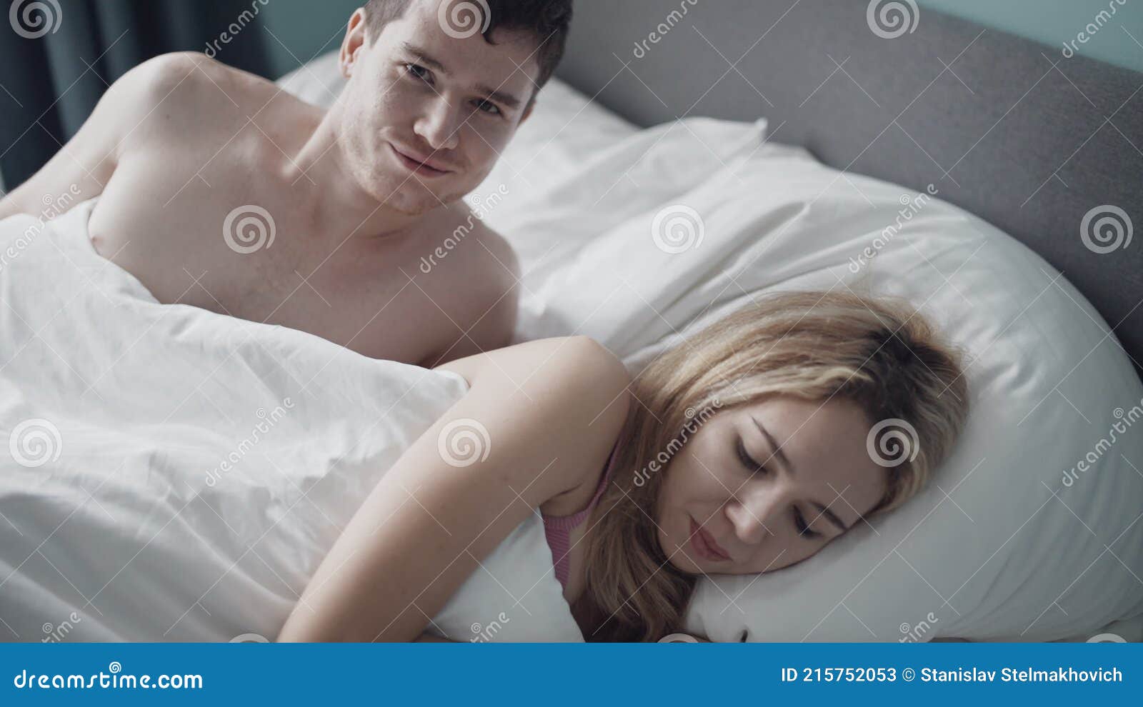Close-up Young Couple Lying in Bed and Having Problems in Sexual Relations