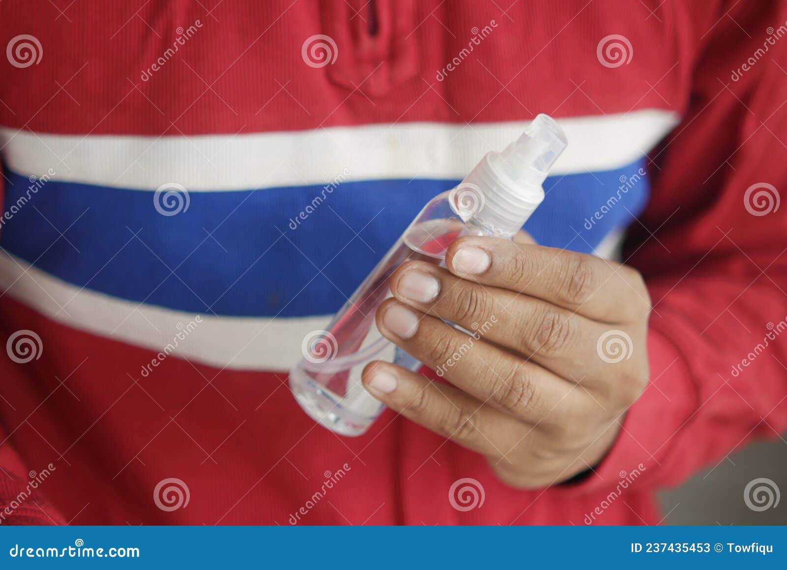 Close Up of Young Man Hand Using Hand Sanitizer Spray. Stock Image