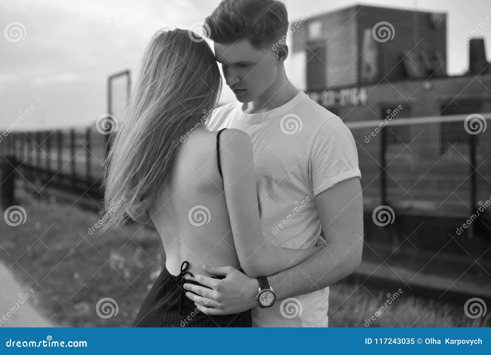 Close-up of Young Romantic Couple is Kissing and Enjoying the Company of Each Other in Black and White