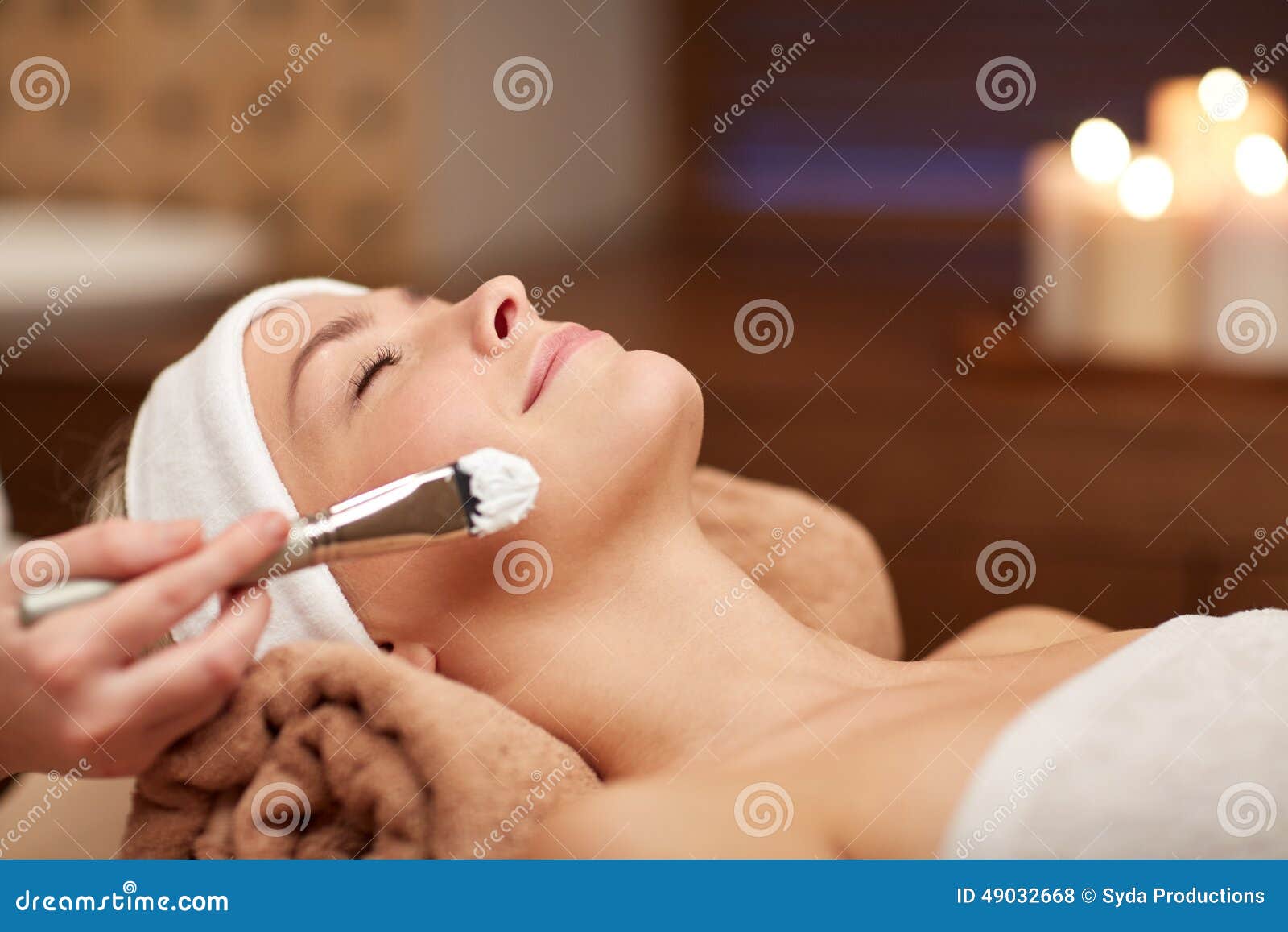 close up of young woman and cosmetologist in spa