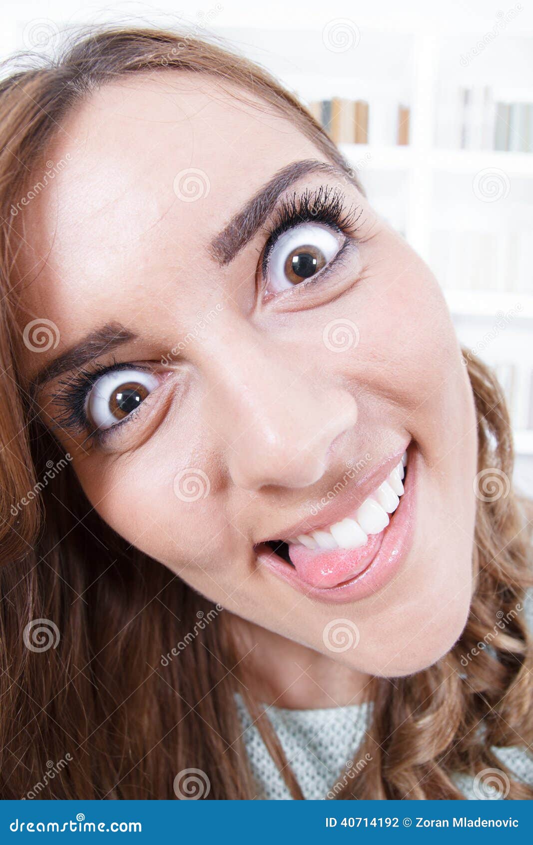 Close Up Of Young Woman With Crazy And Mad Face Expression Stock Photo