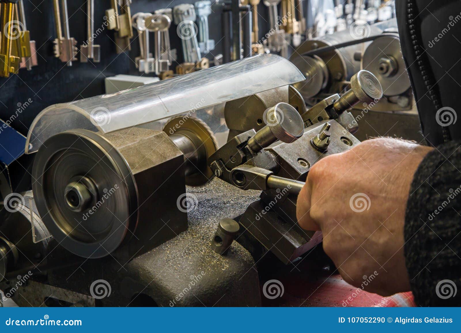 Close View of Key Copying Machine with Keys and Locksmith Hand Stock