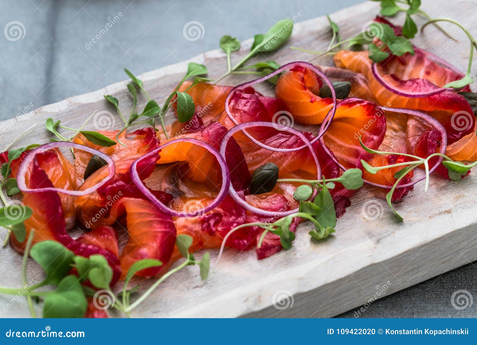 close view sliced gravlax on a white cutting board