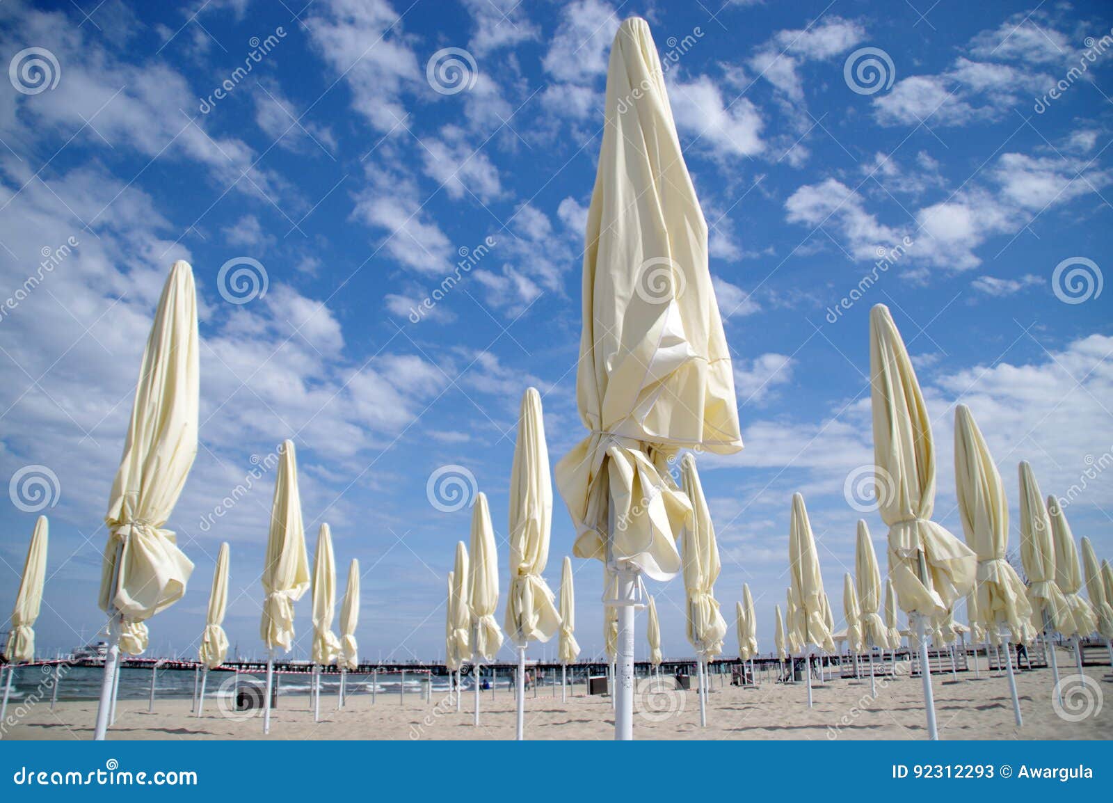 Closed beach umbrellas stock image. Image of umbrellas 92312293