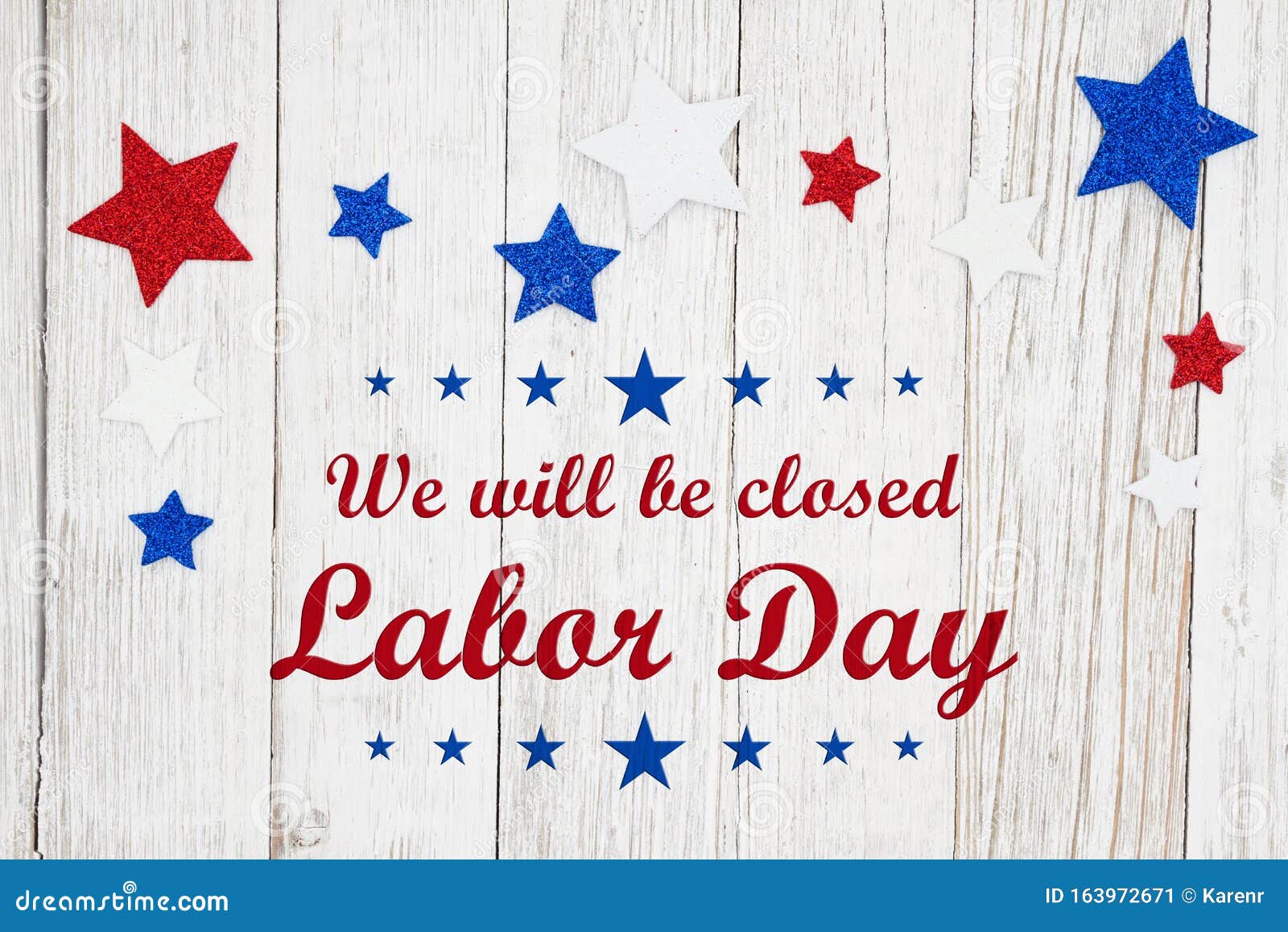 closed labor day with red, white and blue stars on a weathered whitewash