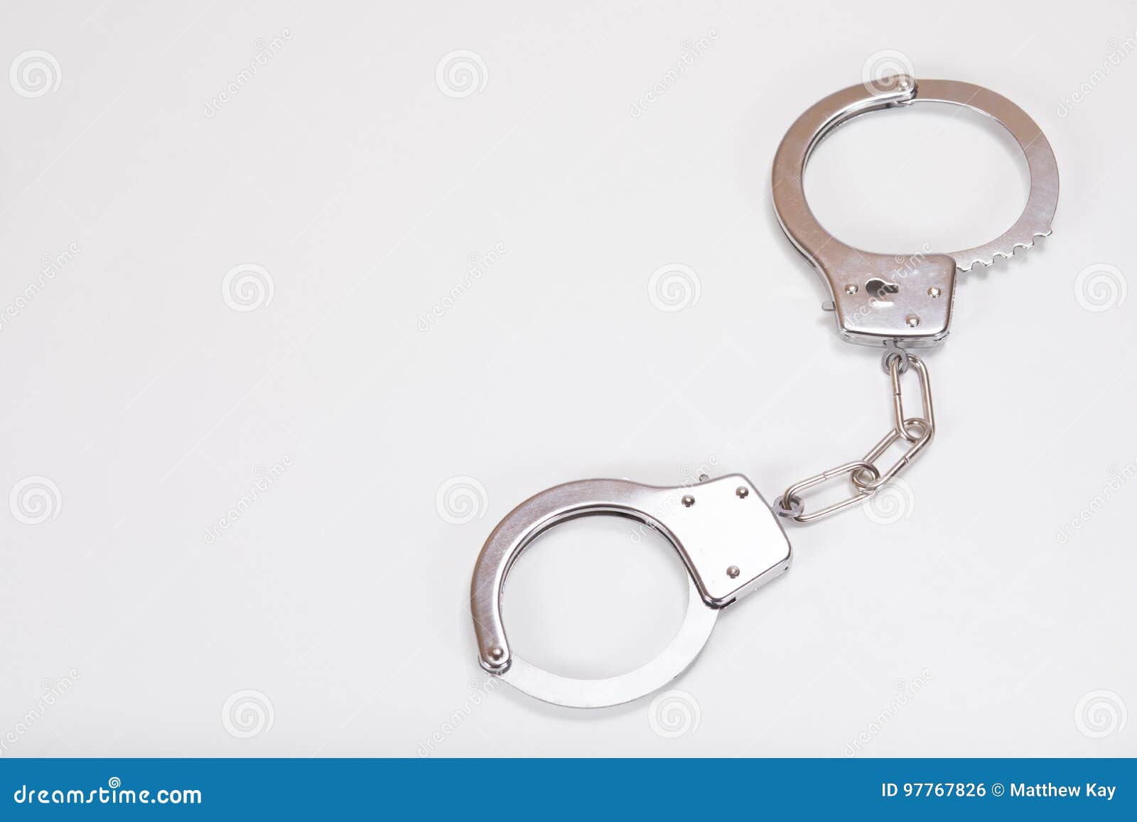 Closed Plastic Toy Handcuffs And White Copy Space Stock Photo Image of arrest, captive 97767826
