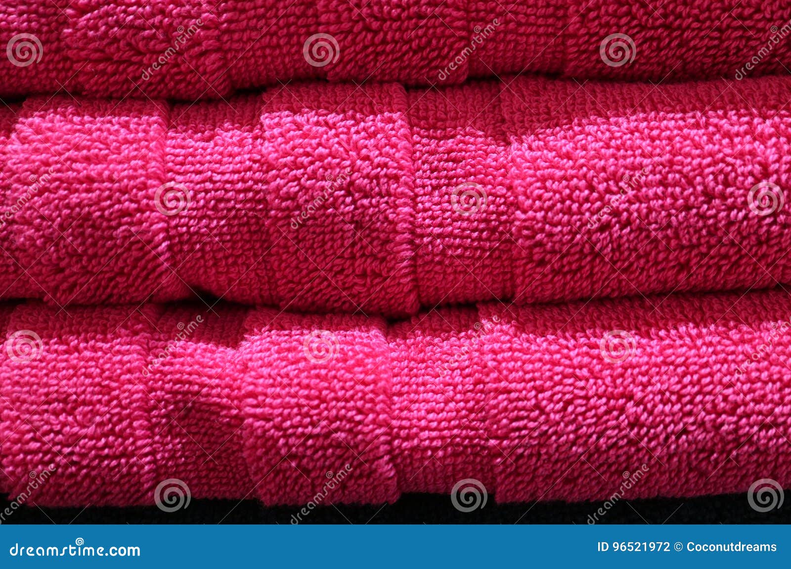 Closed Up Texture of Neatly Folded Vibrant Fuchsia Pink Fluffy Bath