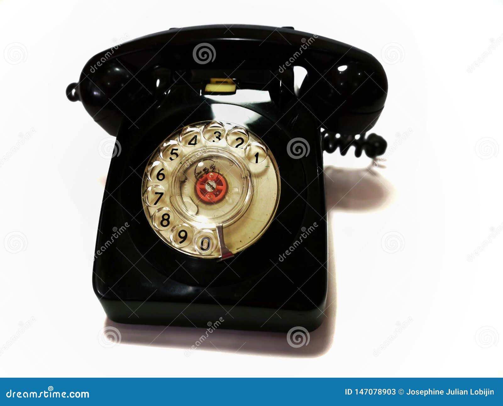 a vintage and antique telephone with white background.
