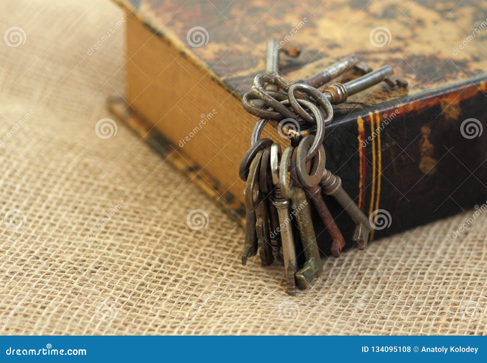 closeup of ancient keys on old folio. secret studies concept. historical studies concept