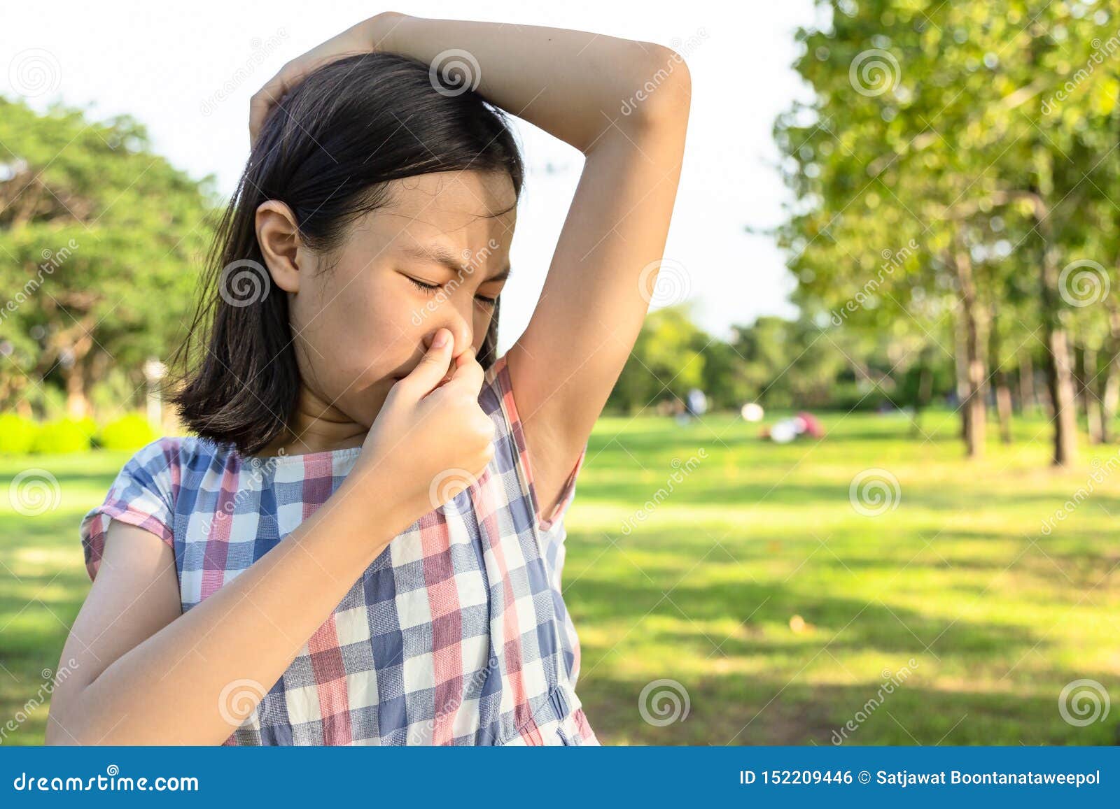 Closeup Asian Cute Little Girl Feel Bad Foul Odor  Situation,smelling,sniffing Her Wet Armpit in Outdoor Park,beautiful Child  Stock Photo - Image of hormonal, hand: 152209446