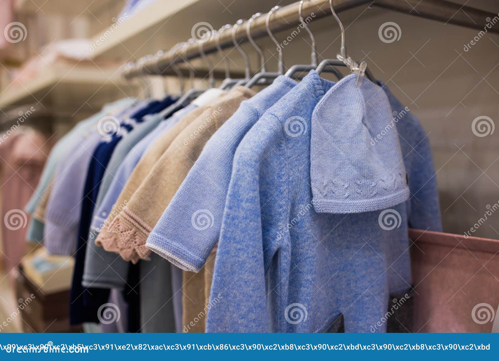 Closeup of Baby Clothes on Rack in a Flea Market. Stock Photo Image