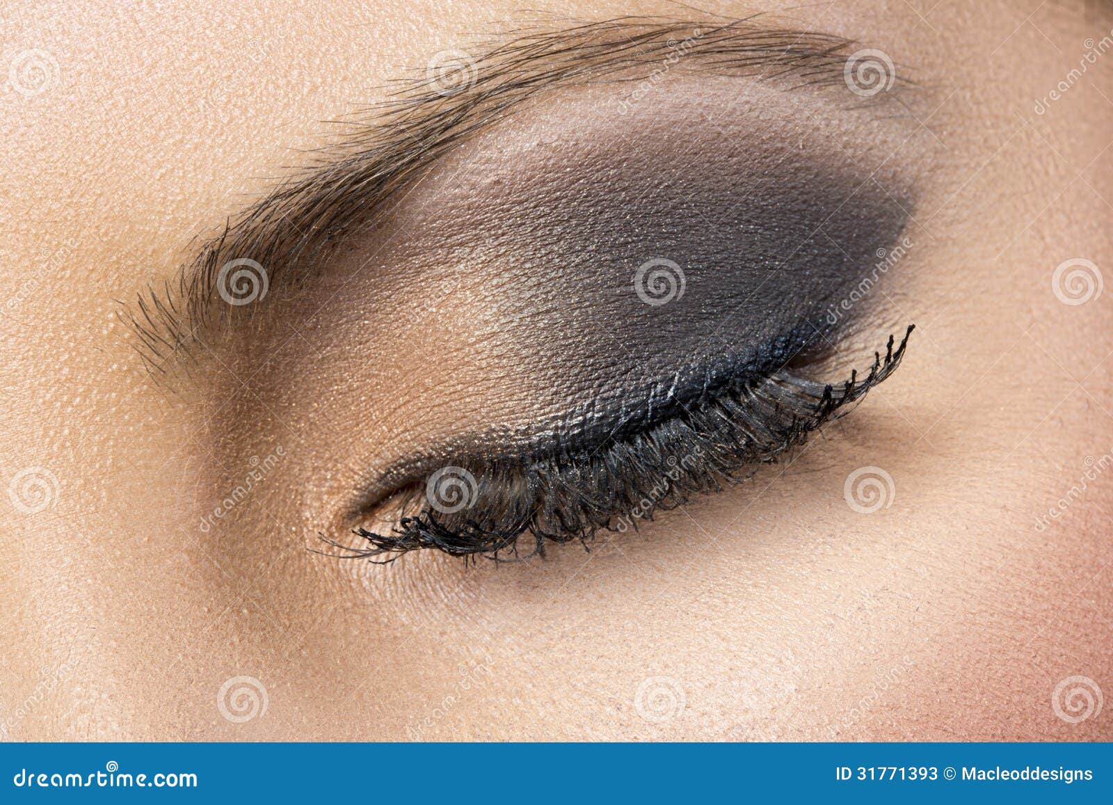 closeup of black and gold smokey eye