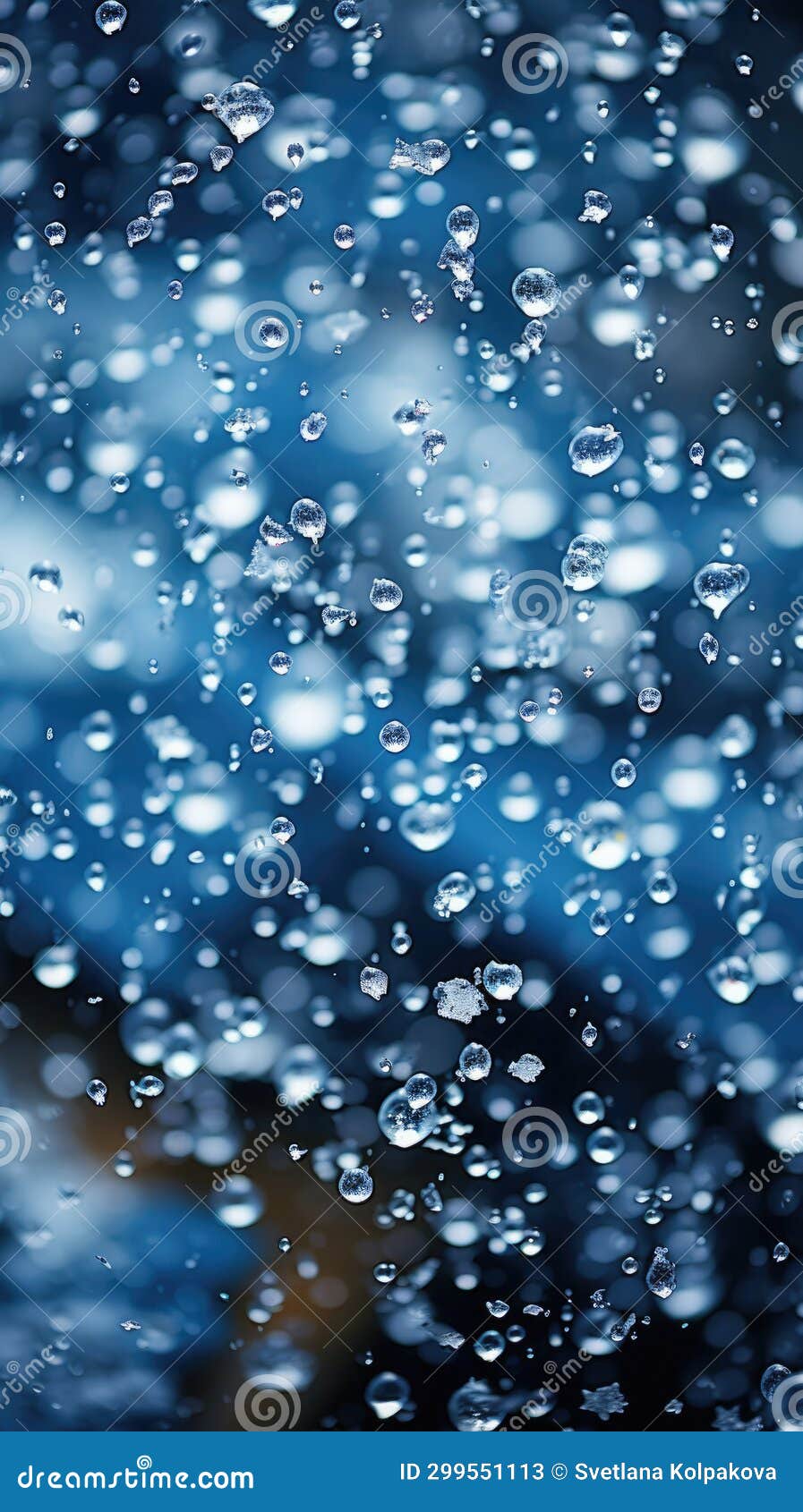 closeup blend of rain and snow on deep blue backdrop. inclement autumn winter weather, sleet