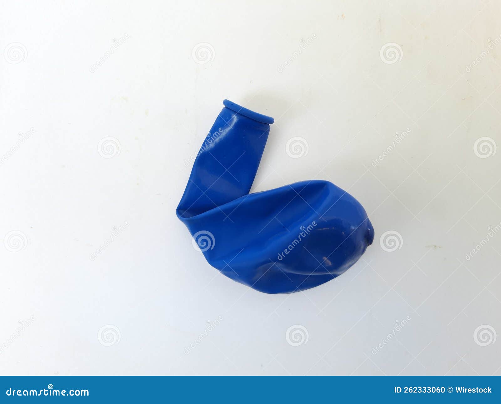 Closeup of a Blue Not Blown Up Balloon Isolated on a Stock Photo