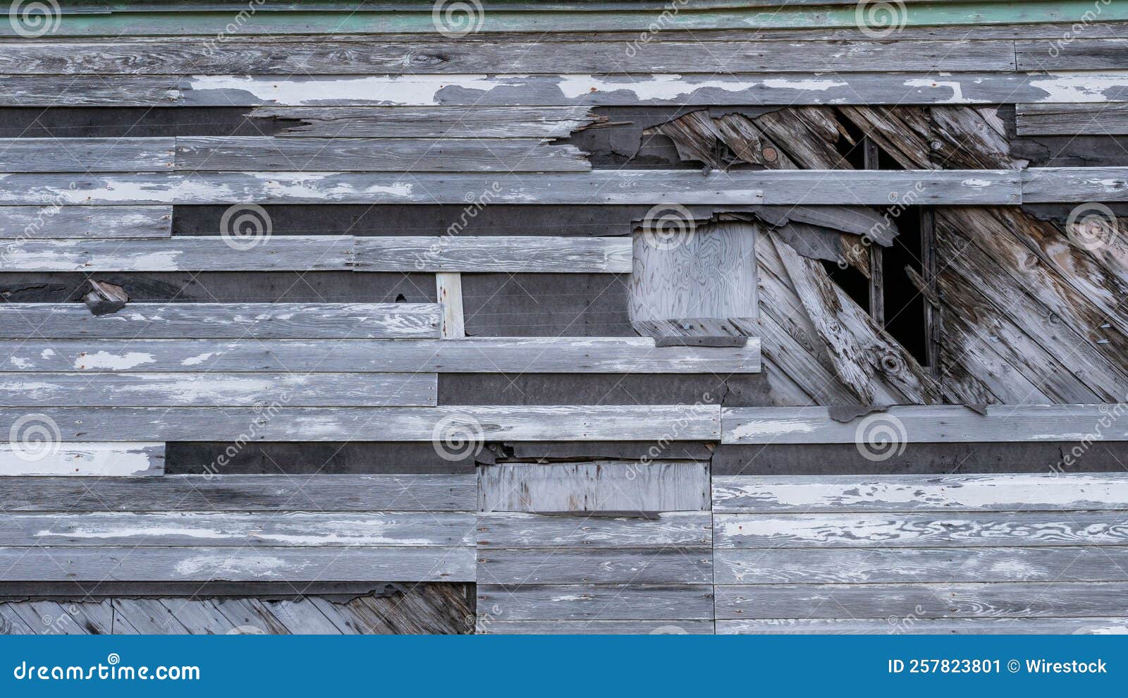 closeup of broken wooden planks on the exterior of the bering hill chapel on adak island