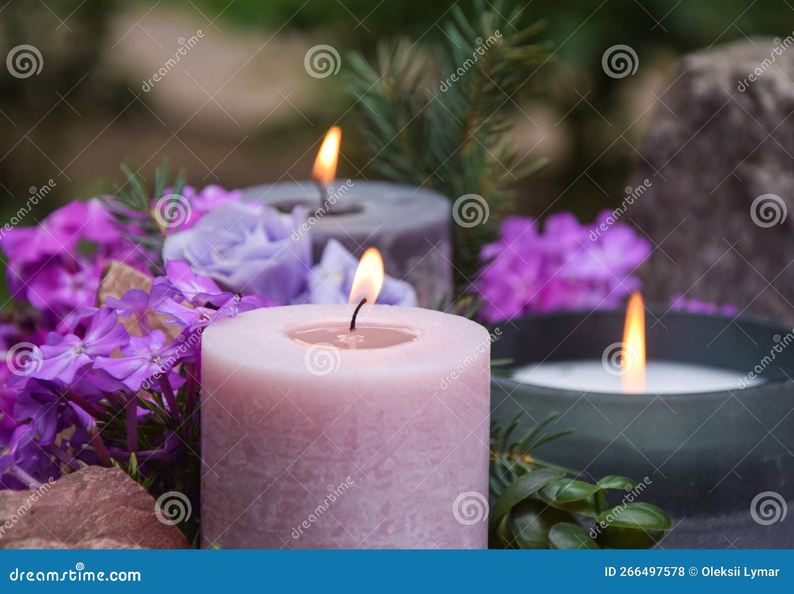 Close-up shot of three beautiful colourful heart-shaped candles with  glitter. Stock Photo by wirestock