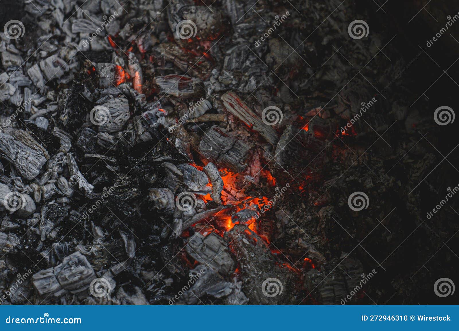 Closeup of Burning Charcoal and Flames in Dark Setting Stock Photo