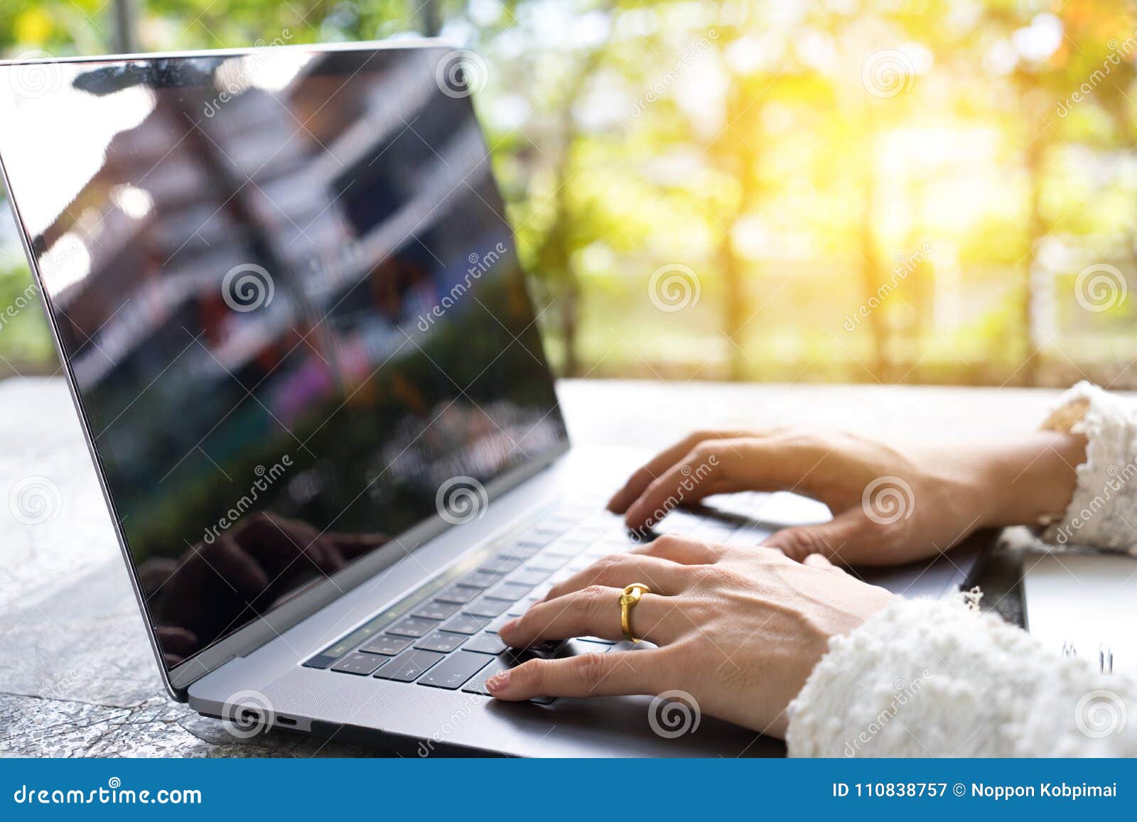 closeup business woman hands typing on laptop keyboard on desk.