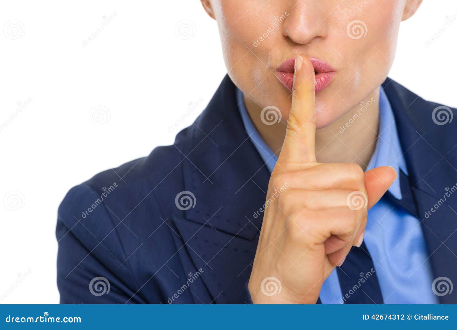closeup on business woman showing shh gesture