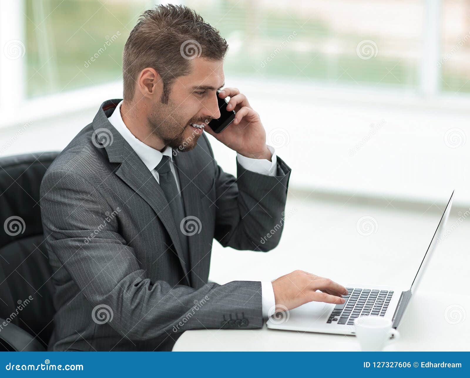 Closeup.businessman Working on Laptop and Talking on the Phone Stock ...