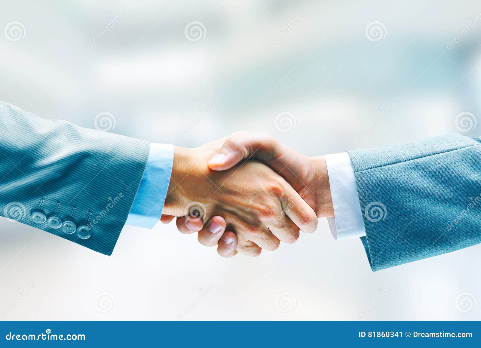 closeup bussines handshake. two men shaking hands. success. agreement