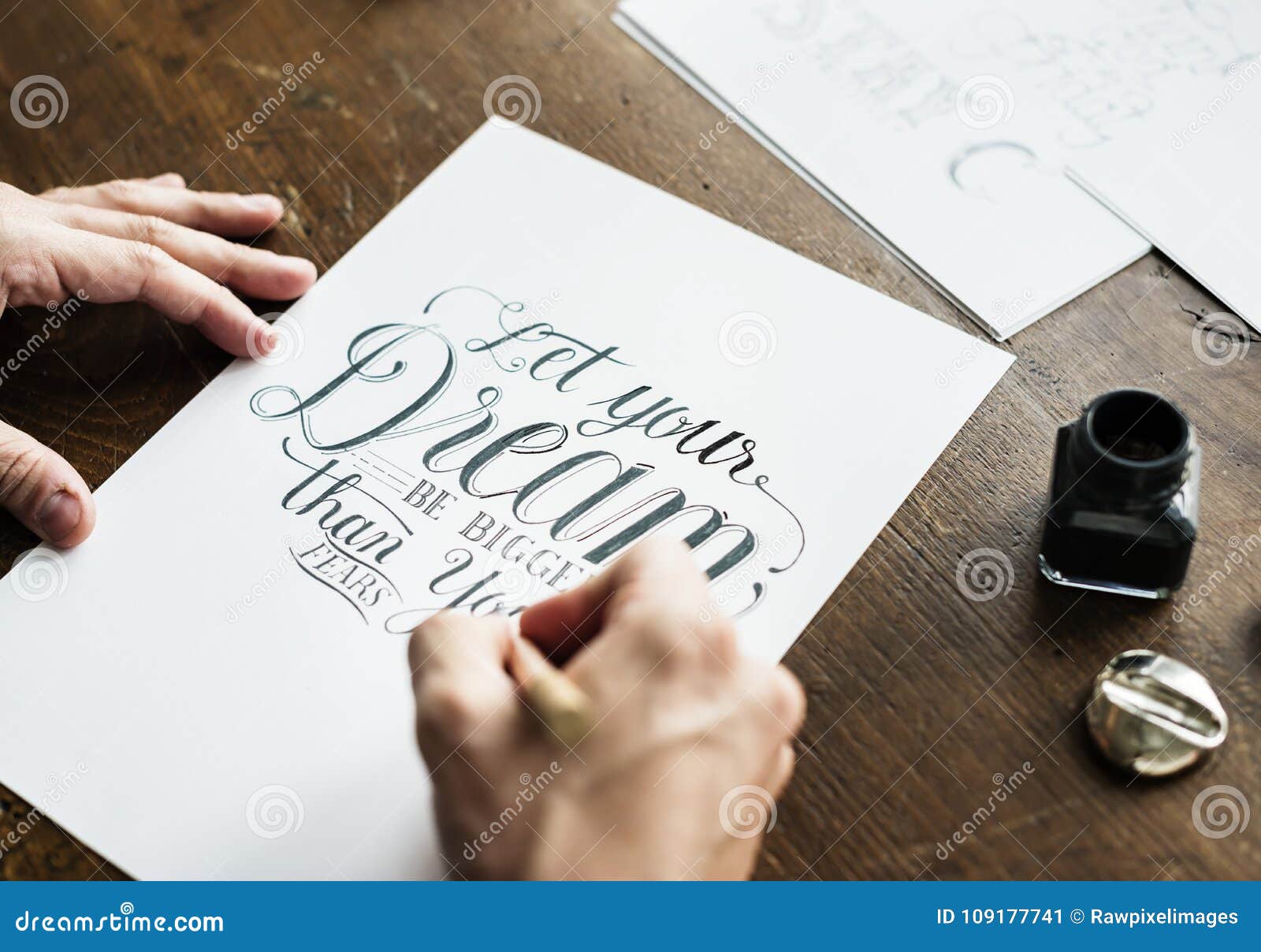 closeup of a calligrapher working on a project