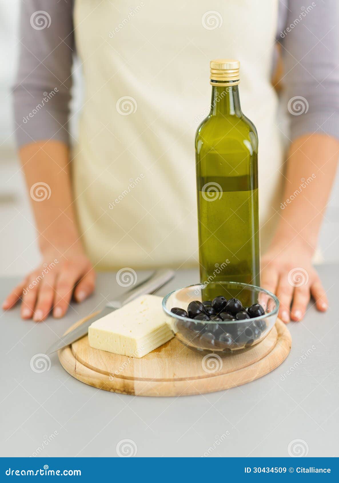 Closeup on Cheese, Olives and Olive Oil on Cutting Board Stock Image