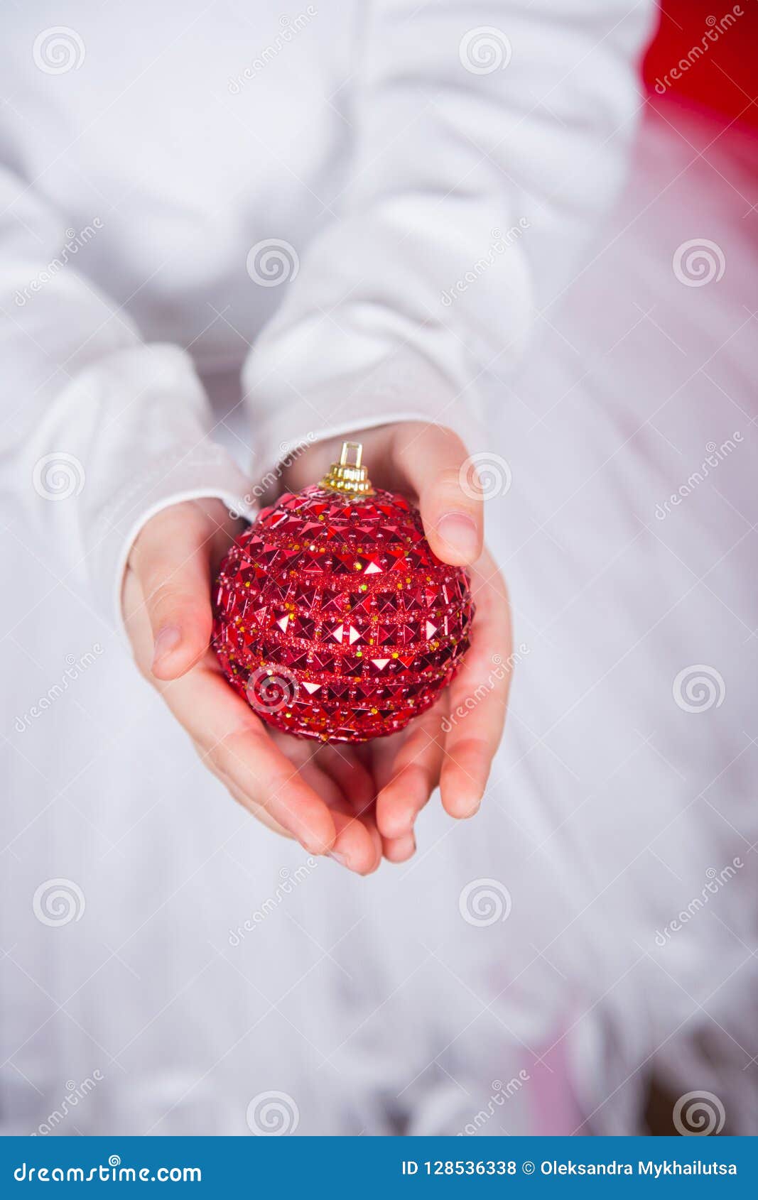 Closeup Children`s Hands Holding Red Christmas Ball. Stock Photo ...