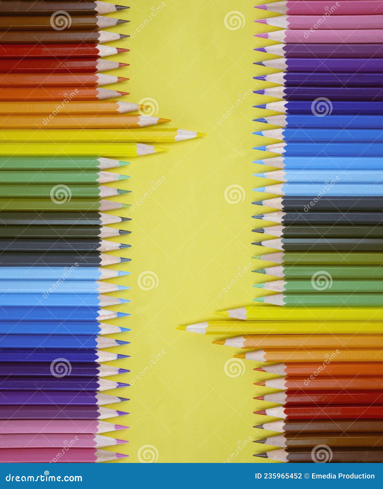 Closeup of Colored Pencils Lined Up in a Row and Abstract Shape on