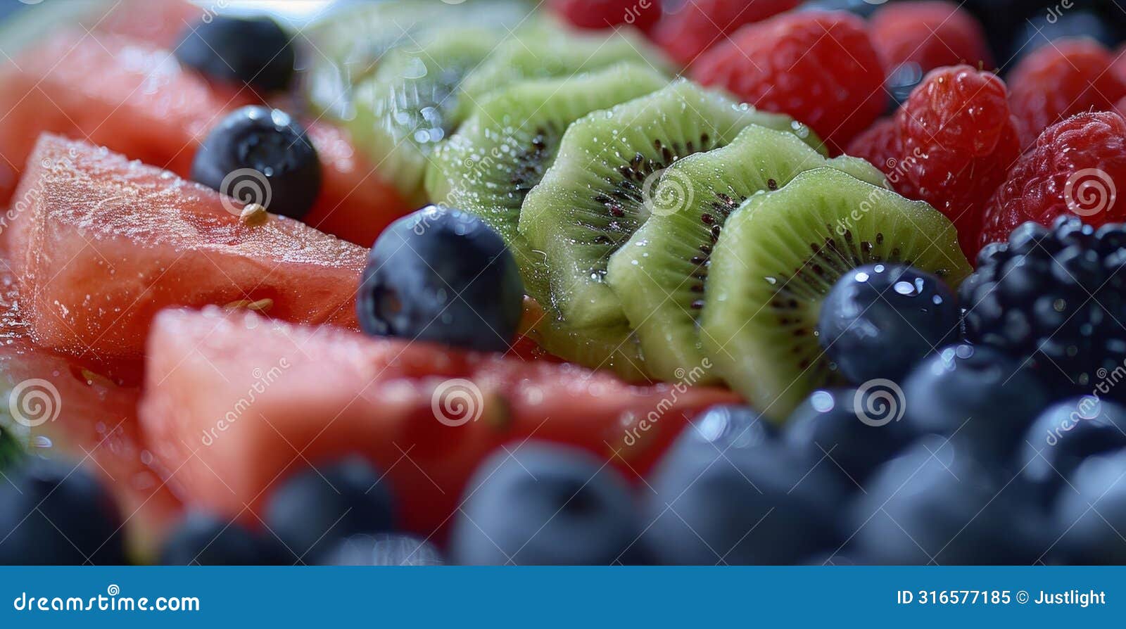 closeup of a colorful fruit platter featuring fresh berries juicy watermelon and sliced kiwi served at a sober sunday