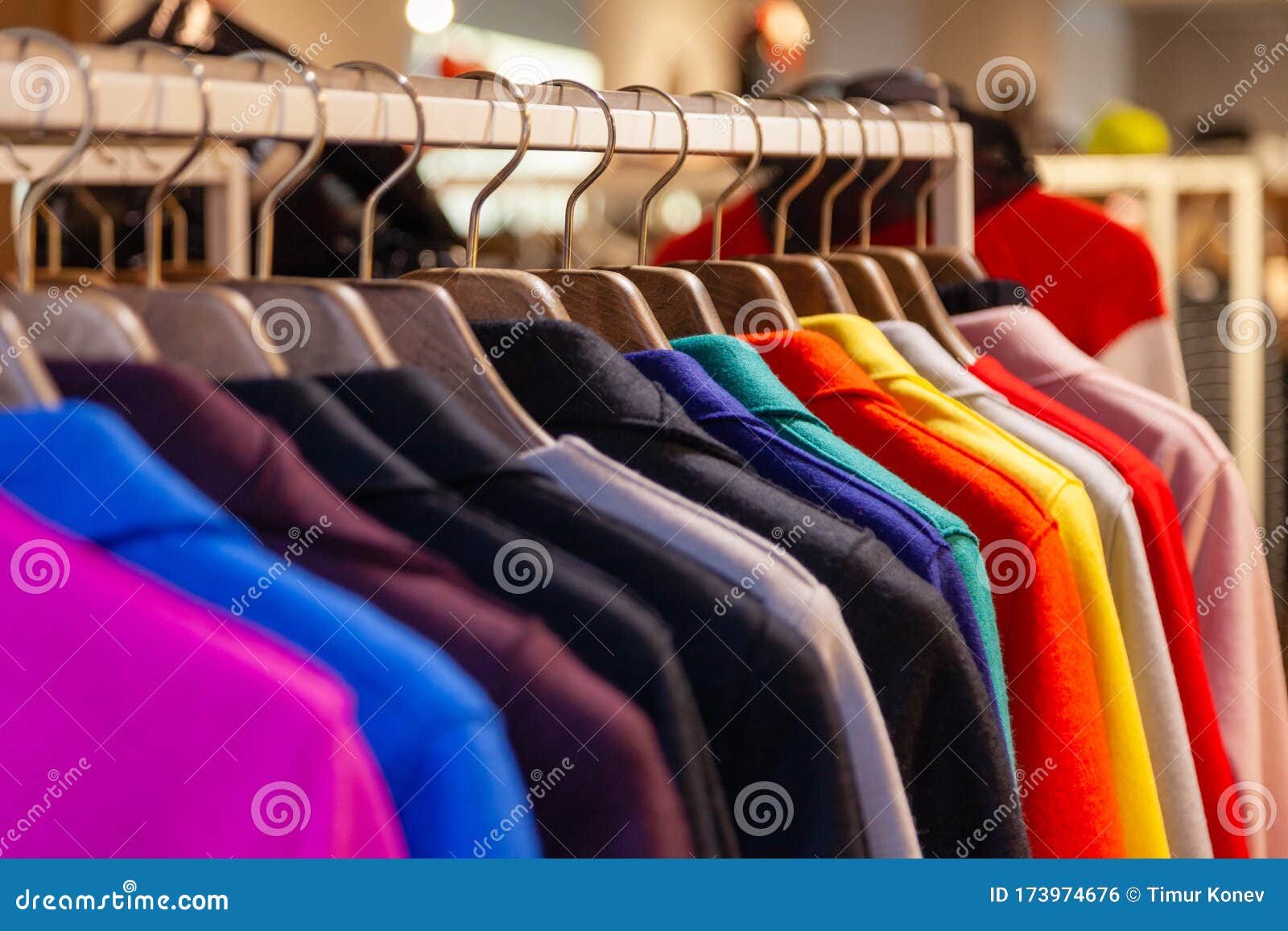 Closeup Colorful Male, Female Clothes in Boutique Hanging on Hangers ...