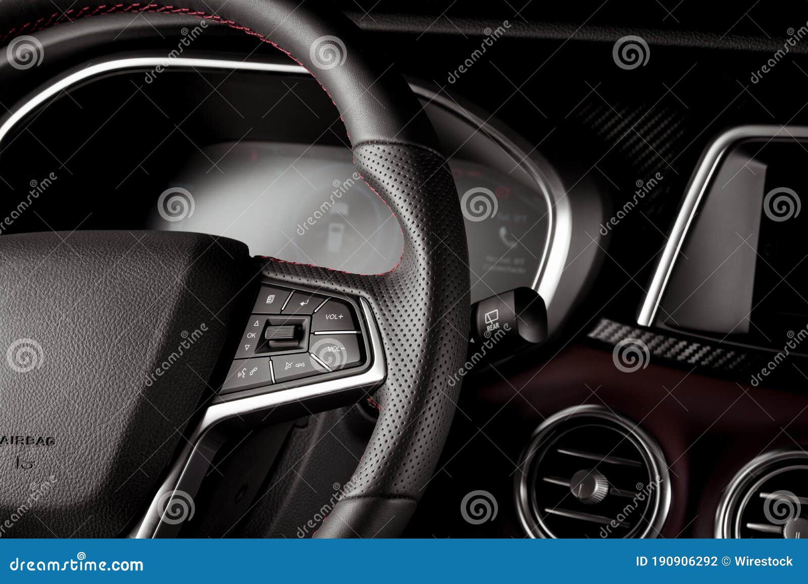 Closeup of the Controls on the Steering Wheel of a New SUV Stock Photo