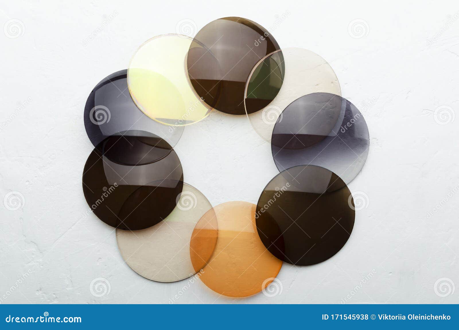 closeup of optical colorful lenses that made a  of circle on the white surface