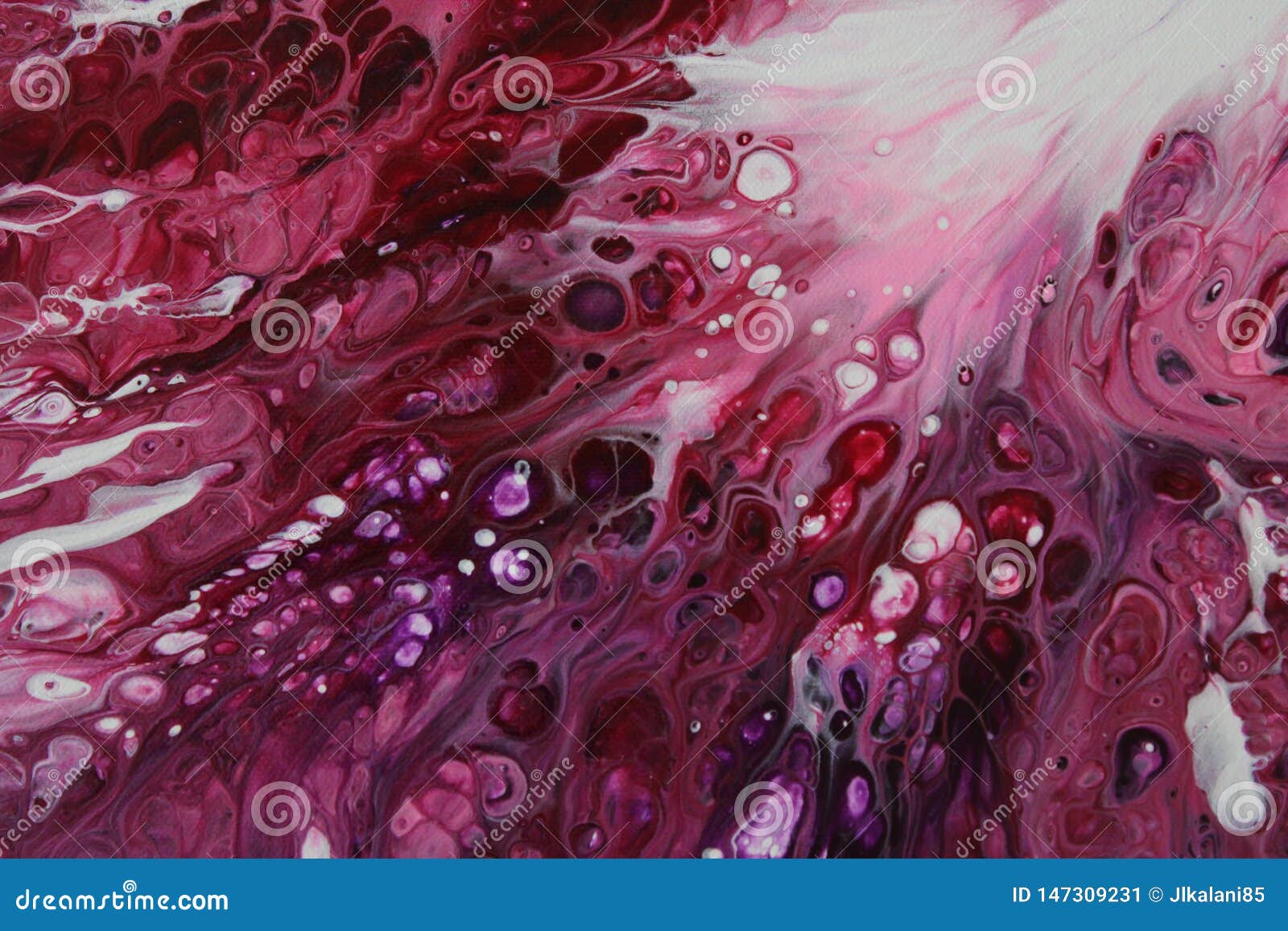 closeup of a flowing abstract acrylic pour painting in shades of pink and white.