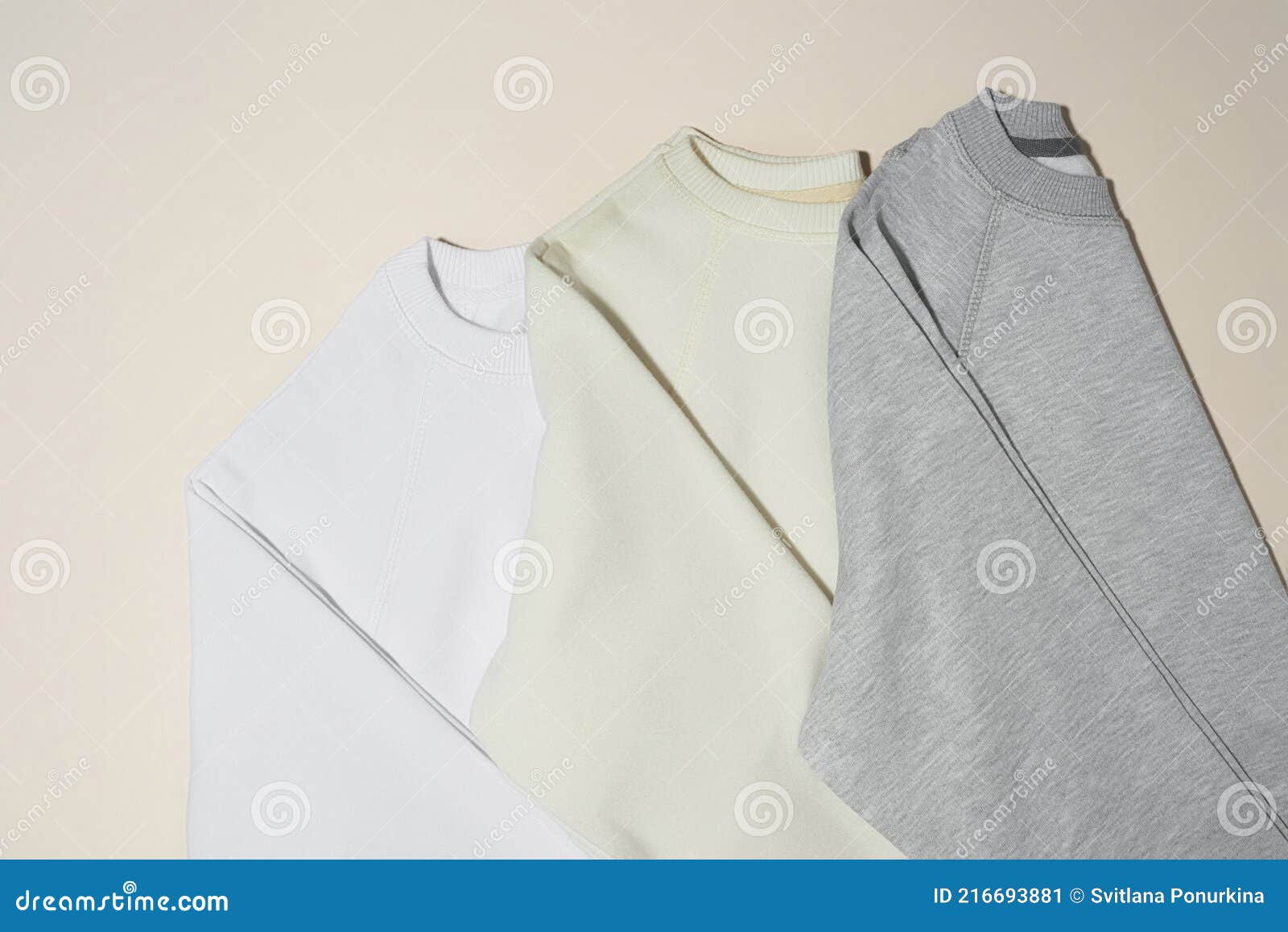 Closeup of Folded Gray, White and Ivory Sport Blank Sweatshirts ...