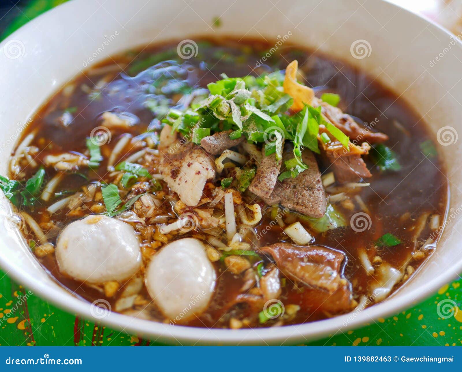 fresh noodles soup with pork and its tasty thick broth guay tiao nam tok moo - delicious and healthy street food in thailand