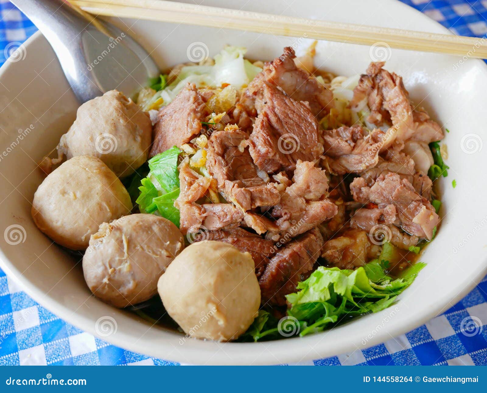 closeup of fresh noodles soup with stewed beef guay tiao nuea - delicious and healthy street food in thailand