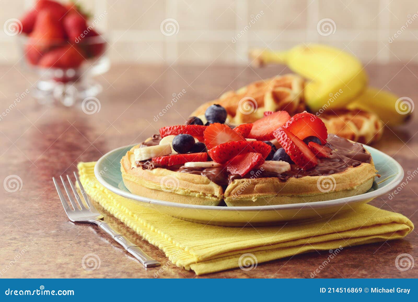 Closeup of Fruit Waffle with Chocolate Spread and a Fork Stock Image