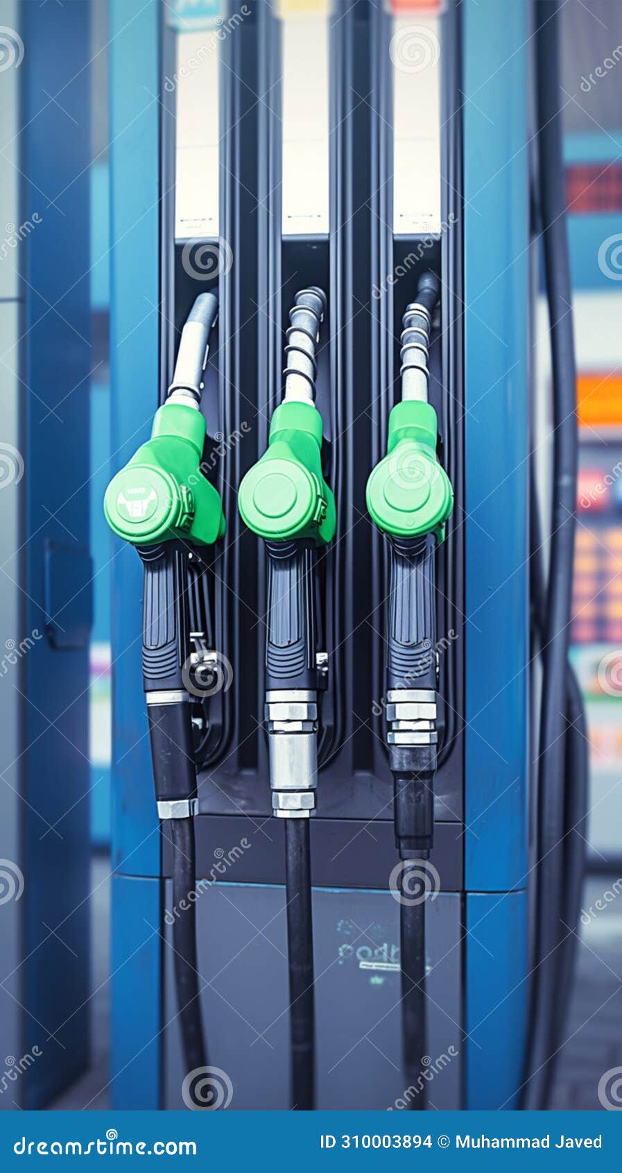 Closeup Fuel Nozzles Dispensing Petrol and Diesel at Station Stock
