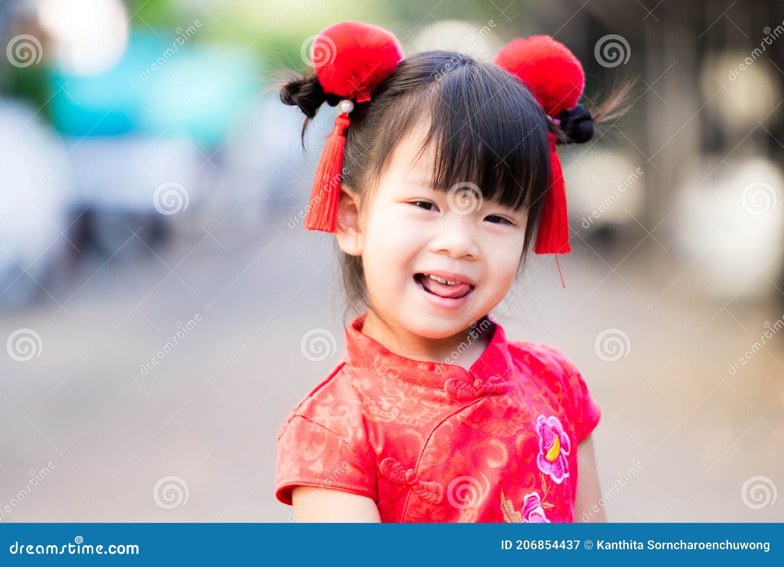 Closeup the Girl Shows a Pretty Cheeky Face. Happy Child in Chinese New  Year Stock Image - Image of fluffy, people: 206854437