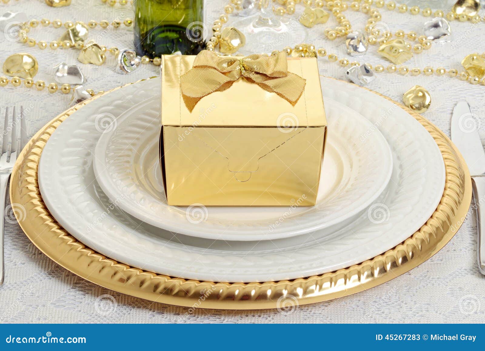 Closeup Gold Gift with Table Setting Stock Image Image of gift