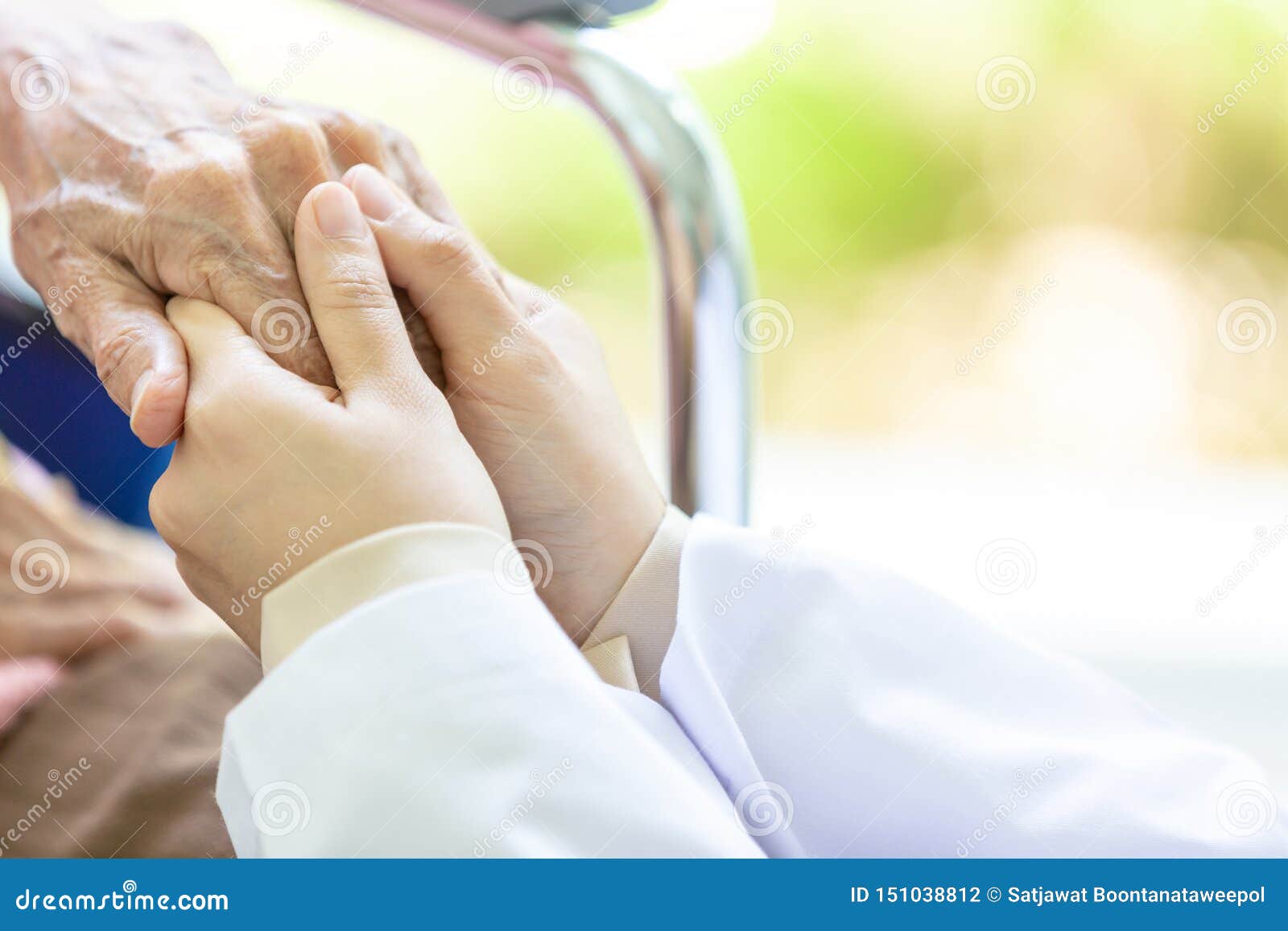 closeup of hand medical female doctor or nurse holding senior patient hands and comforting her,.caring caregiver woman supporting