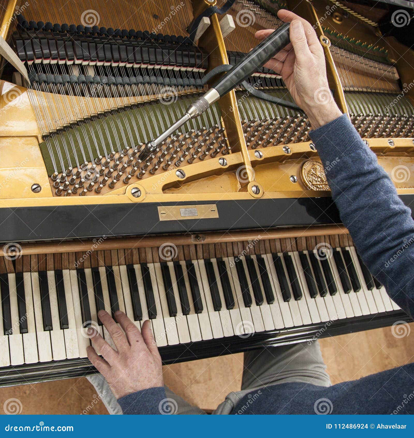 Hand and Tools of Tuner Working on Grand Piano Stock Photo Image of